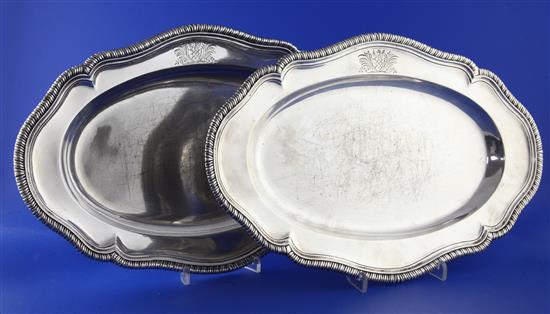 A pair of George II silver shaped oval meat dishes by Elizabeth Godfrey, 58 oz.
